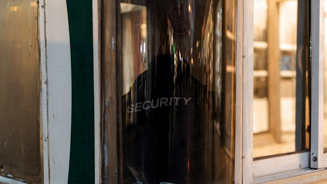 store security guard watching customer