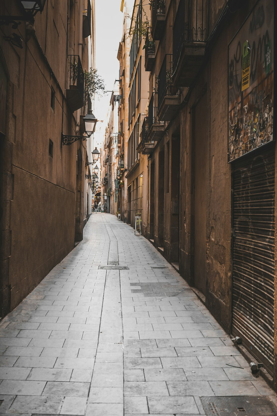 Narrow cobblestone alley between old houses